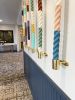 Vertical Painted Ropes | Wall Sculpture in Wall Hangings by Cassandra Smith | Triton Square Apartments in Groton