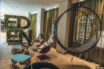 Modern Wheel in the Celebrity Edge Cruise | Swing Chair in Chairs by Studio Stirling. Item made of steel works with minimalism & coastal style