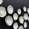 Large Abstract wall art set of 23 textured ceramic flowers | Wall Sculpture in Wall Hangings by Elizabeth Prince Ceramics. Item composed of ceramic in minimalism or mid century modern style
