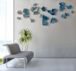 "Fragment" Wall Installation in Aqua to Teal | Sculptures by Debra Steidel. Item made of ceramic works with minimalism & contemporary style