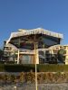 Handmade Macrame Boho Beach Umbrella with Cotton Fringe | Textiles by Dimitar Kostadinov | Aparthotel Crotiria in Burgas