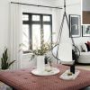 Studio Stirling Sling - House and Home Canada Jan/Feb 2021 | Swing Chair in Chairs by Studio Stirling. Item made of steel & leather compatible with modern style