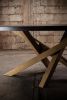 Oval Black Oak Dining Table, Criss Cross Golden Base | Tables by NO AGE FURNITURE STUDIO. Item composed of oak wood