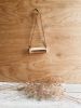 Horizontal Wall Hanging | Wall Sculpture in Wall Hangings by Bridget Dorr. Item composed of ceramic and leather