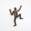 SET of 2 climbing man and woman | Sculptures by NUNTCHI. Item made of metal works with art deco style