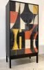 Bossa Armoire by Morgan Clayhall – Mixed Media Art on Doors | Cabinet in Storage by Morgan Clayhall. Item made of walnut & steel