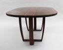 Oval walnut table, Trapeze leg, with book-matched top. | Dining Table in Tables by Jonathan Field. Item composed of walnut