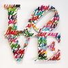 "Love" on wooden panel | Wall Sculpture in Wall Hangings by Ruben Rojas. Item composed of birch wood and synthetic