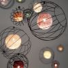 Orbs Suspended Lights Installation | Lighting Design by Claudine Gevry Studio | Salari Fine Carpets in Vancouver. Item composed of copper