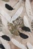 The phoenix between feathers | Mixed Media by Vero Gonzalez Ugarte. Item composed of linen and paper