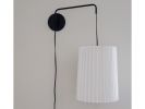 Industrial sconce with pleated toten lampshade, black and w | Sconces by Studio Pleat. Item made of metal & paper compatible with mid century modern and contemporary style