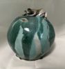 Cat on Green vessel | Sculptures by Sheila Blunt. Item composed of ceramic in contemporary style
