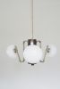 Coronette 3 Chandelier | Chandeliers by Sara Schoenberger. Item composed of brass & glass compatible with minimalism and mid century modern style