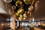 Bubble | Chandeliers by Illuminata Art Glass Design by Julie Conway | Din Tai Fung in Bellevue. Item made of brass & glass