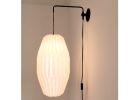 Industrial sconce with pleated LONG OVAL lampshade | Sconces by Studio Pleat. Item made of metal with paper works with mid century modern & contemporary style