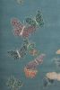 Spirit in the sky. Blue background rug with butterflies | Area Rug in Rugs by Sergio Mannino Studio. Item composed of fiber