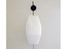 Industrial sconce with pleated LONG OVAL lampshade | Sconces by Studio Pleat. Item made of metal with paper works with mid century modern & contemporary style