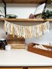 Hand-Ripped Fabric Tassel Garland | Tapestry in Wall Hangings by Over the Knotted Moon. Item made of fabric