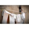 Laundry Lady Italy | Photography by Suzann Kaltbaum. Item composed of metal