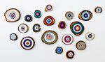 A Wall of Wooden Circle Slices | Wall Sculpture in Wall Hangings by Modern Slice. Item made of wood with synthetic