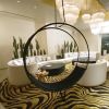 Wheel Swing Chair in the Virgin Hotel, Las Vegas | Chairs by Studio Stirling. Item composed of steel in boho or contemporary style