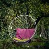 Bubble Hanging Swing Chair - Pink and Green Cushions | Chairs by Studio Stirling | Ten Stirling Bed and Breakfast in Johannesburg. Item made of steel works with minimalism & modern style