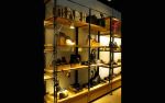 Perimeter Shelving System | Storage by Amuneal | Cole Haan in New York. Item composed of wood and metal