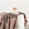 Flo Brown Handloom Merino Throw | Linens & Bedding by Studio Variously. Item made of fabric with fiber