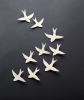 Porcelain wall hanging swallows sculpture artwork set of 9 | Wall Sculpture in Wall Hangings by Elizabeth Prince Ceramics. Item made of ceramic compatible with minimalism and contemporary style