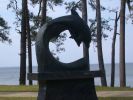 Dolphin Family | Public Sculptures by Jim Sardonis | Fairhope in Fairhope. Item made of bronze with stone