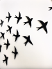 Set of 20 black porcelain ceramic bird wall artwork | Wall Sculpture in Wall Hangings by Elizabeth Prince Ceramics. Item composed of ceramic in minimalism or mid century modern style