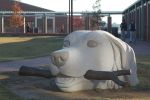 Swimming Retriever | Public Sculptures by Jim Sardonis. Item made of bronze & stone