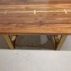 Brass inlay tunnel table | Dining Table in Tables by YJ Interiors. Item made of walnut with brass works with mid century modern & contemporary style