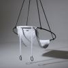 Soft Leather Swing in Santorini, Greece | Easy Chair in Chairs by Studio Stirling | Abyss Santorini in Oia. Item made of steel with leather works with boho & art deco style