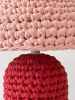 The Knitty Table Lamp in Cherry Red and Pale Pink | Lamps by Meg Morrison. Item made of fabric with ceramic works with boho & mid century modern style