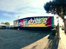“Love Rises” | Street Murals by Ruben Rojas. Item composed of synthetic