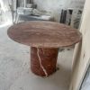 Red Travertine Round Pedestal Dining Table | Tables by Phidias Atelier. Item made of stone