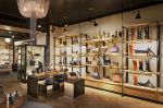 Perimeter Shelving System | Storage by Amuneal | Cole Haan in New York. Item composed of wood and steel