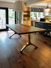 Black walnut dining table with brass wishbone legs | Tables by YJ Interiors. Item made of walnut with brass works with mid century modern & contemporary style