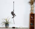 Climbing woman on rope, Metal wall sculpture | Wall Hangings by NUNTCHI. Item made of metal works with contemporary style