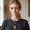 Artisan Manjushri Thangka Ash Clay Buddhist Amulet Pendant | Ornament in Decorative Objects by Dynasty Artisan. Item made of leather compatible with contemporary and eclectic & maximalism style