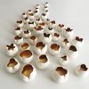 Tulips, Porcelain Wall Installation of 40 flowers White Gold | Wall Sculpture in Wall Hangings by Maap Studio. Item made of ceramic