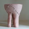 Hand shaped organic ceramic table in red-pink stoneware | Side Table in Tables by Ingrid Vermulst by Studio Wild Orange. Item composed of stoneware compatible with contemporary and japandi style