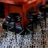 Round Backless Bar Stools - Model 2525 | Chairs by Richardson Seating Corporation | The GMan Tavern in Chicago. Item composed of brass