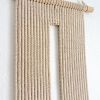 Keyhole macrame wall hanging | Wall Hangings by YASHI DESIGNS. Item made of cotton with fiber works with mid century modern & contemporary style