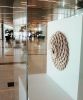 Hive | Wall Sculpture in Wall Hangings by Susannah Mira | George Bush Intercontinental Airport in Houston. Item composed of wood