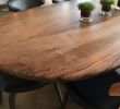 Oval 'Pebble Edged' Walnut Table on Black Waxed Steel Legs | Dining Table in Tables by Jonathan Field. Item composed of walnut and steel
