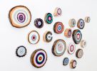 A Wall of Wooden Circle Slices | Wall Sculpture in Wall Hangings by Modern Slice. Item made of wood with synthetic