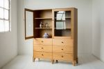 Pacific Curio Cabinet in American Cherry | Storage by Studio Moe. Item composed of wood