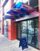 The Nail Hall Colored Vinyl Awning | Glasswork in Wall Treatments by Nicole Mueller | The Nail Hall in San Francisco. Item made of synthetic